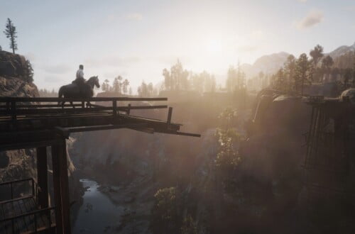 Arthur Morgan on a rose gray Andalusian horse walking on Bacchus Bridge. The bridge is broken and Arthur and the horse are walking towards the break. Across the bridge, the sun sets. We can see the Dakota River below them.