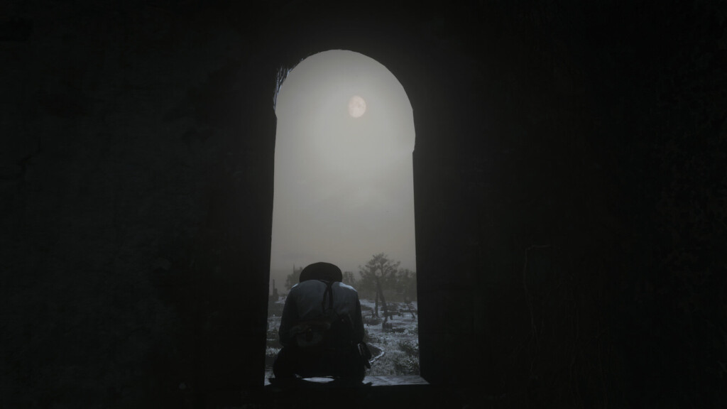 Arthur Morgan sitting in a window in the Abandoned Church Point of Interest, looking out over Bolger Glade. It's night, and the moon shines through the clouds above him.