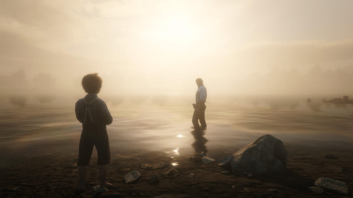 Arthur Morgan standing in Flatiron Lake. He looks back at Jack Marston, who stands on the shore. The photo is backlit and the light is misty and glowing.