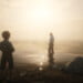 Arthur Morgan standing in Flatiron Lake. He looks back at Jack Marston, who stands on the shore. The photo is backlit and the light is misty and glowing.