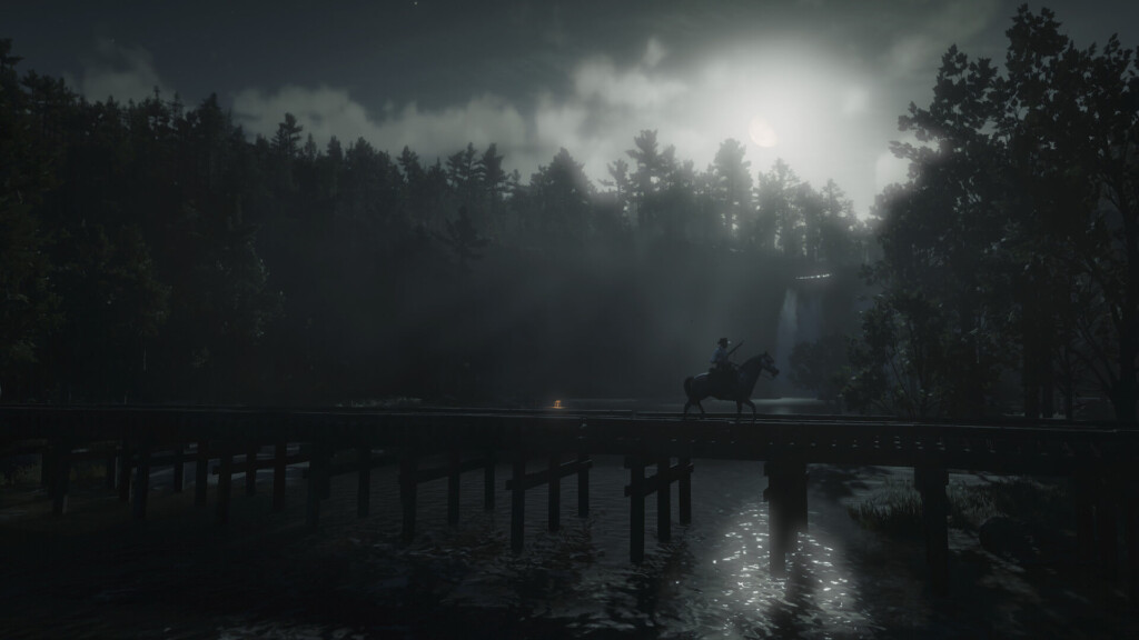 A train trestle over a river. A figure holding a rifle rides a horse across it. In the background, the moon and a waterfall flow behind fog.