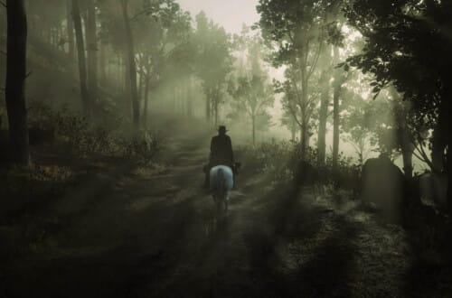 Arthur Morgan, dressed in black and riding a white Arabian in the Roanoke woods. Sunlight shines through the mist and trees.