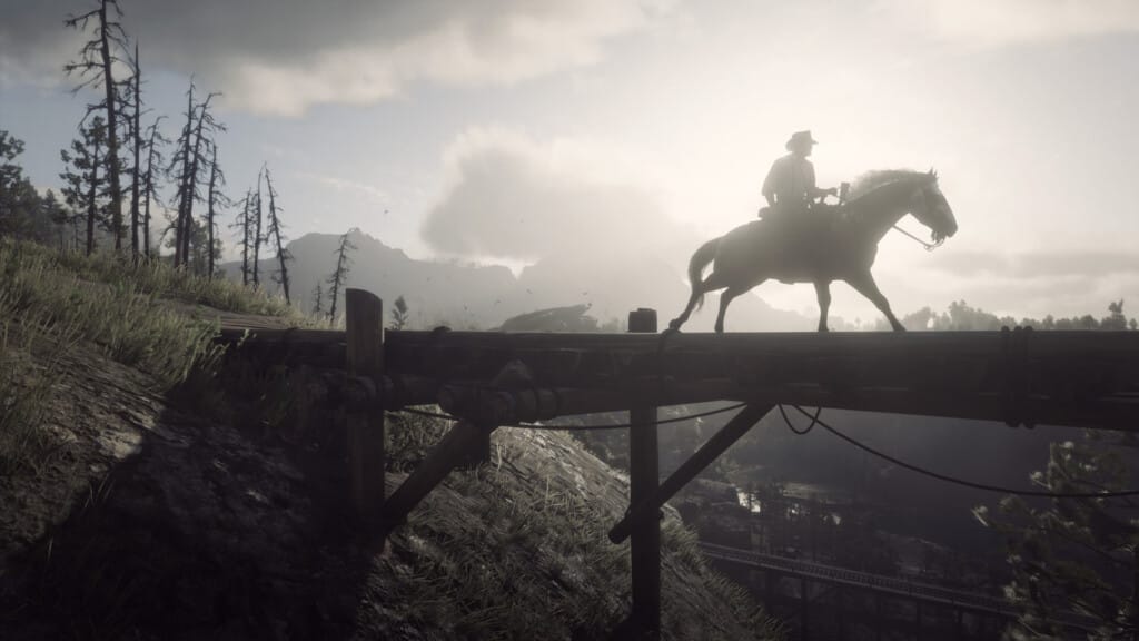 Arthur Morgan riding a rose gray Andalusian mare across a wooden bridge in Ambarino. The sun lights the clouds behind him.