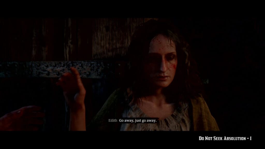 A screenshot of Edith Downes in the mission "Do Not Seek Absolution 1." Edith has damaged skin and is dressed in a shawl and her shift. Her condition reflects that of her counterpart in "The Story of the Grail."