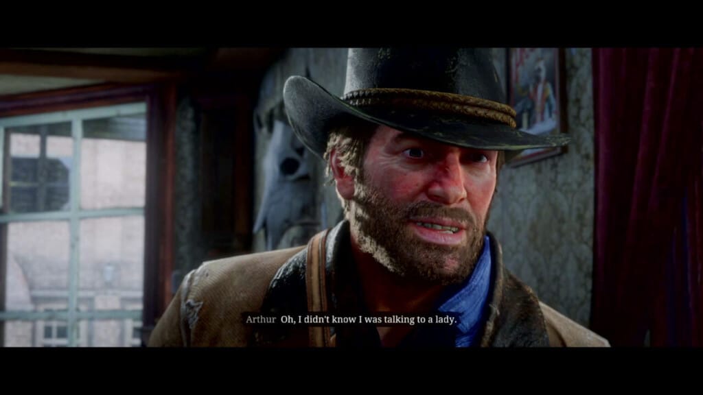 A screenshot of Arthur Morgan from the mission "Americans at Rest." Arthur nastily snarls "Oh, I didn't know I was talking to a lady."