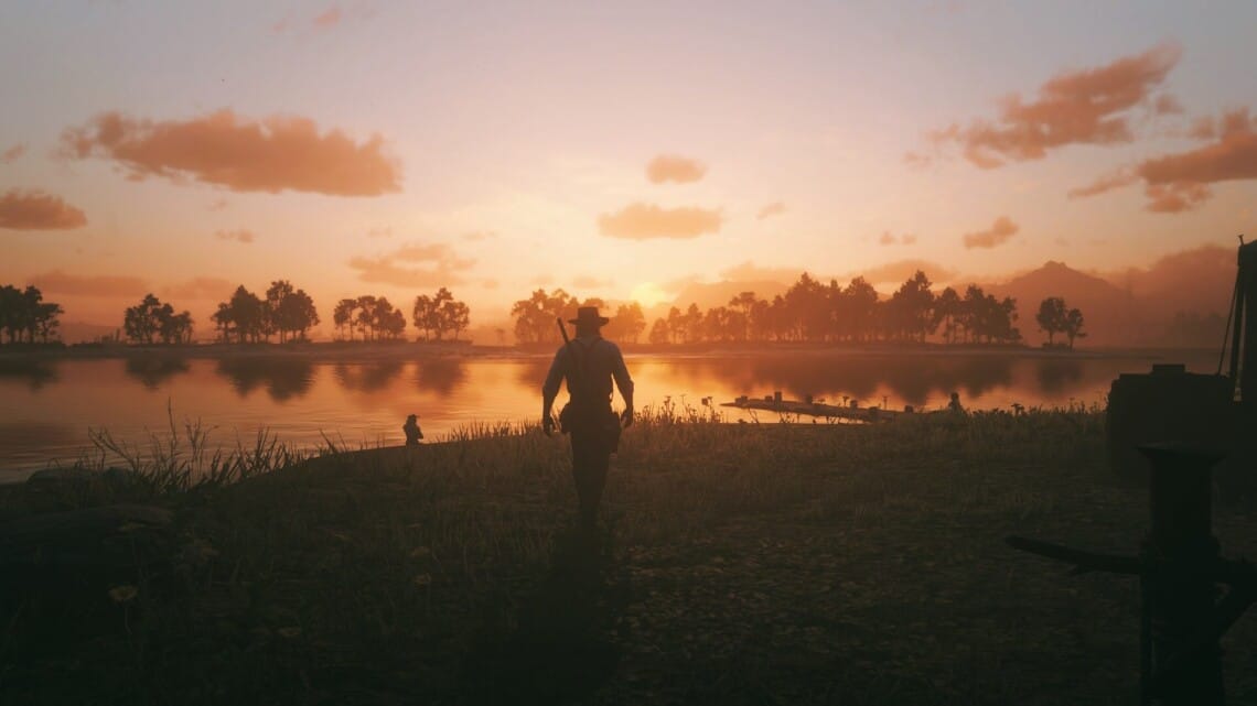 Arthur Morgan at Clemens Point, walking towards the sun as it sets over Flatiron Lake.