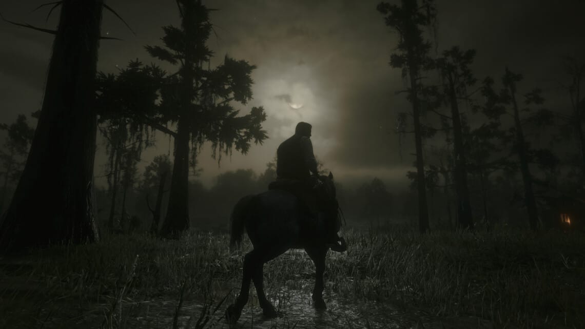Arthur Morgan on a Nokota horse. The moon is in front of them, banked by clouds.
