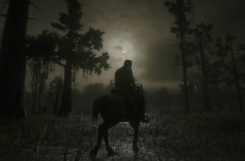 Arthur Morgan on a Nokota horse. The moon is in front of them, banked by clouds.