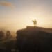 Arthur Morgan on a horse atop the Face Rock in Lemoyne. The setting sun gives him a halo.