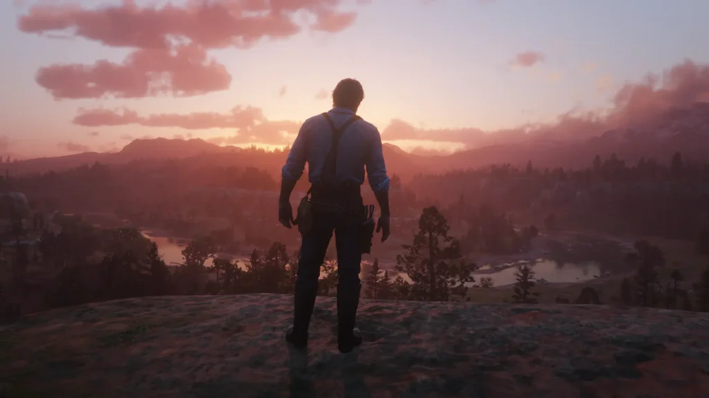 Arthur Morgan standing at Horseshoe Overlook at sunset, looking out the river and mountains.